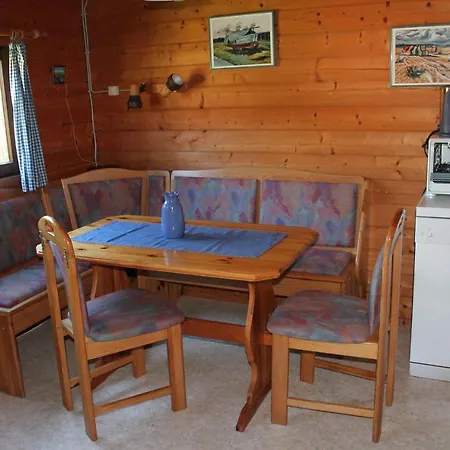 Feriehus Haus-Seerobbe-Blockhaus-Im-Garten *